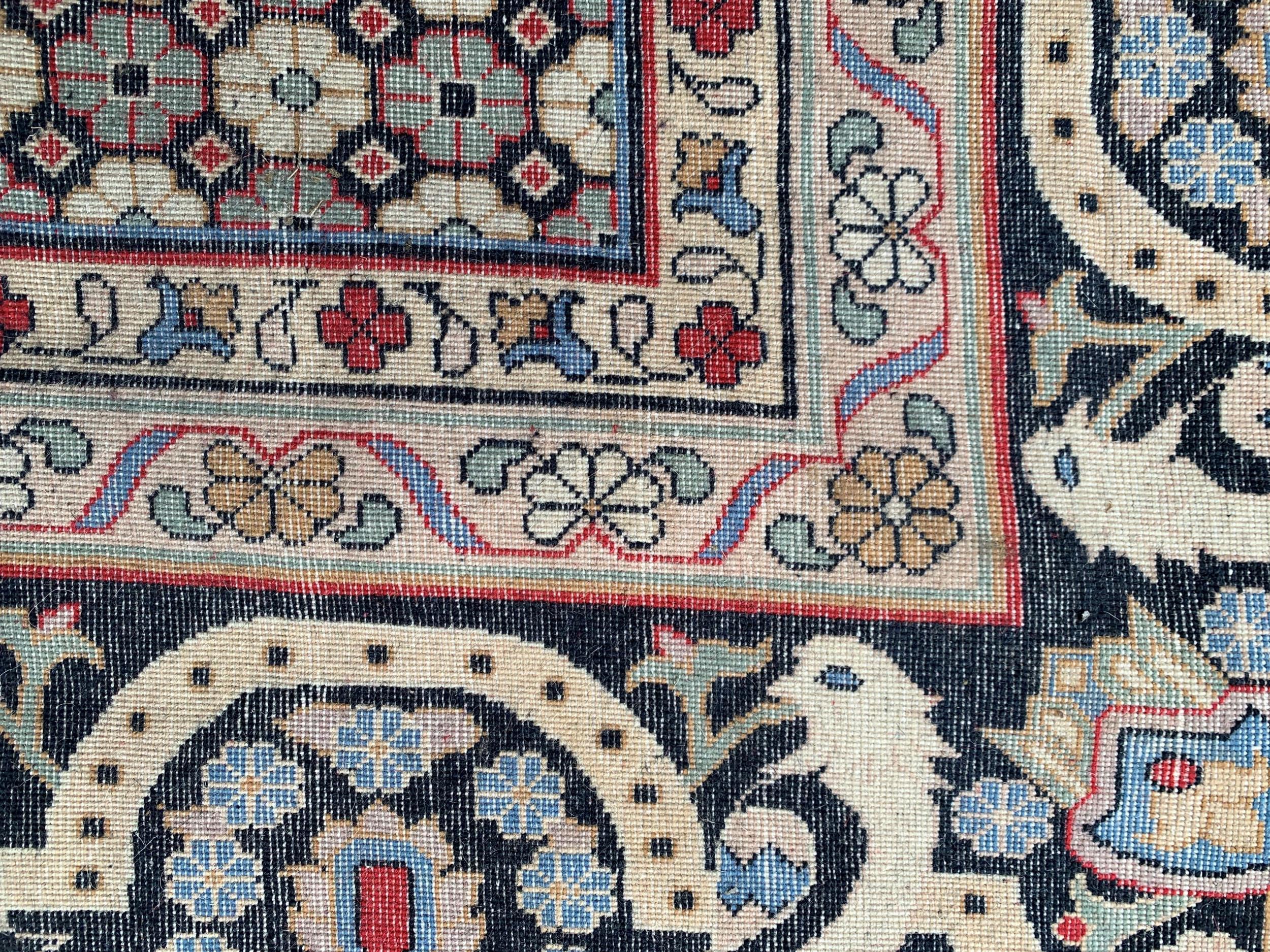 Large Indo Persian carpet with a medallion and vase design on a salmon ground with corner designs - Image 5 of 5