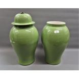 Pair of modern green glazed baluster form vases (one lacking cover)