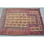 Small Belouch prayer rug with a beige field, all-over stylised flowerhead design and red ground