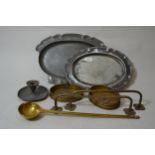 Oval pewter platter, another larger (at fault), pewter chamber stick (at fault), brass ladle, two