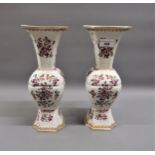 Pair of hard paste porcelain square baluster form armorial vases having enamel and floral decoration