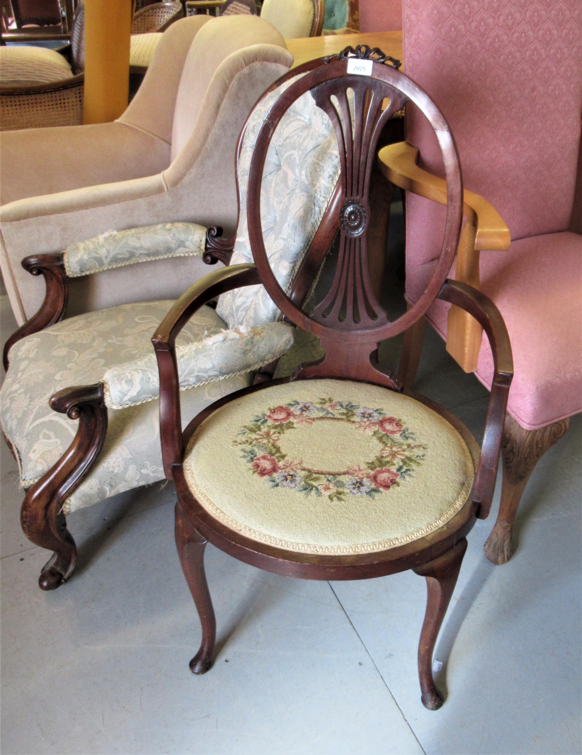 Edwardian mahogany open elbow chair with pierced oval back, upholstered seat and cabriole front