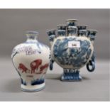 Two modern Chinese blue and white vases, one with dragon decoration and ring handles, the other
