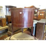 Late 19th Century mahogany line inlaid corner washstand, having galleried top above two bow doors,