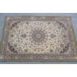 Persian pattern machine woven carpet on beige ground, approximately 9ft x 6ft