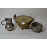 Middle Eastern silvered copper jug and similar bowl, together with a circular brass swing handled