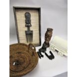 African hardwood figural hair comb, framed, two other items of African native wood carving, a