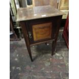 Late 19th / early 20th Century walnut bedside cupboard, having fielded panel doors on square