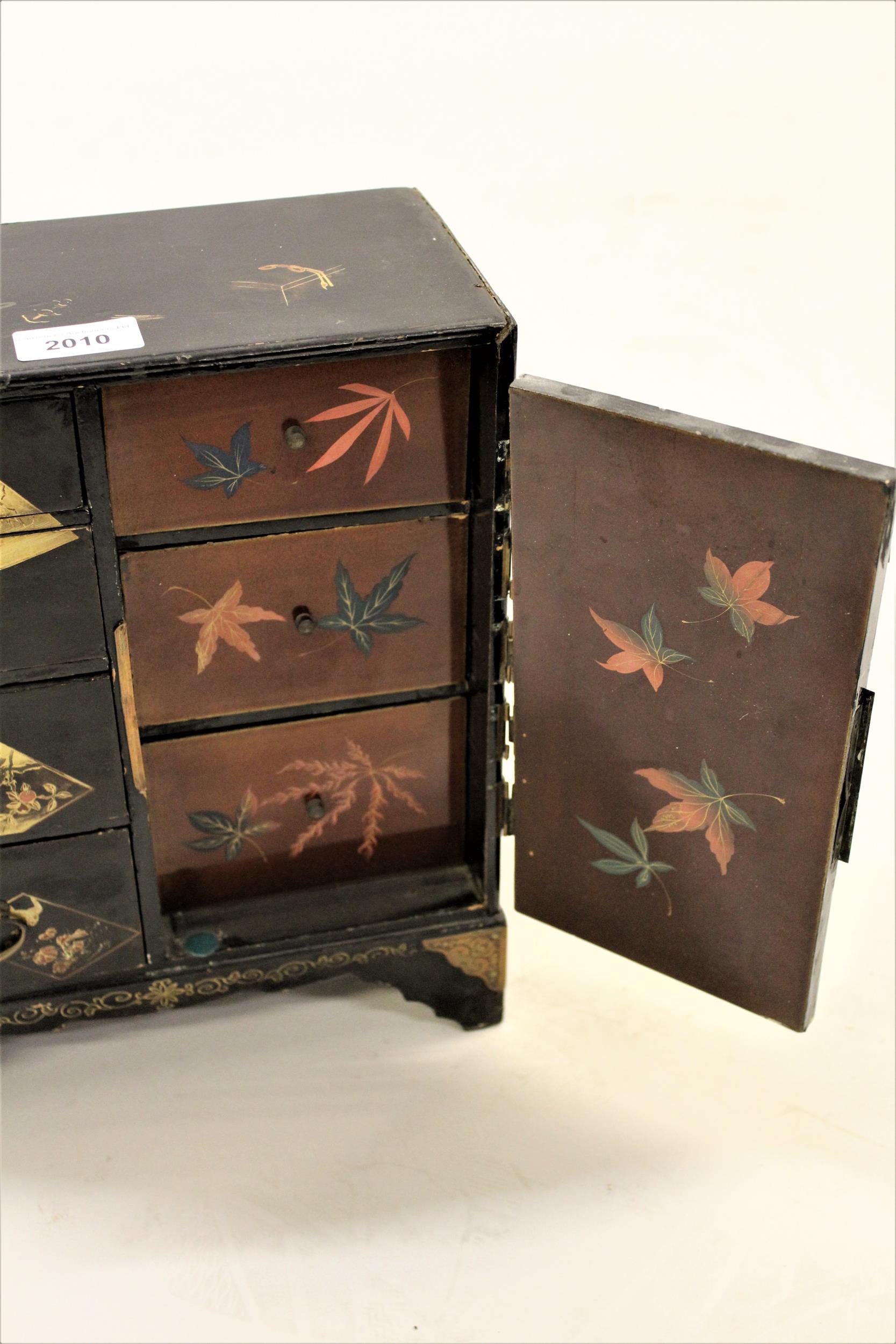 Japanese black lacquer table jewellery cabinet with gilded decoration, with four drawers, a single - Image 2 of 2