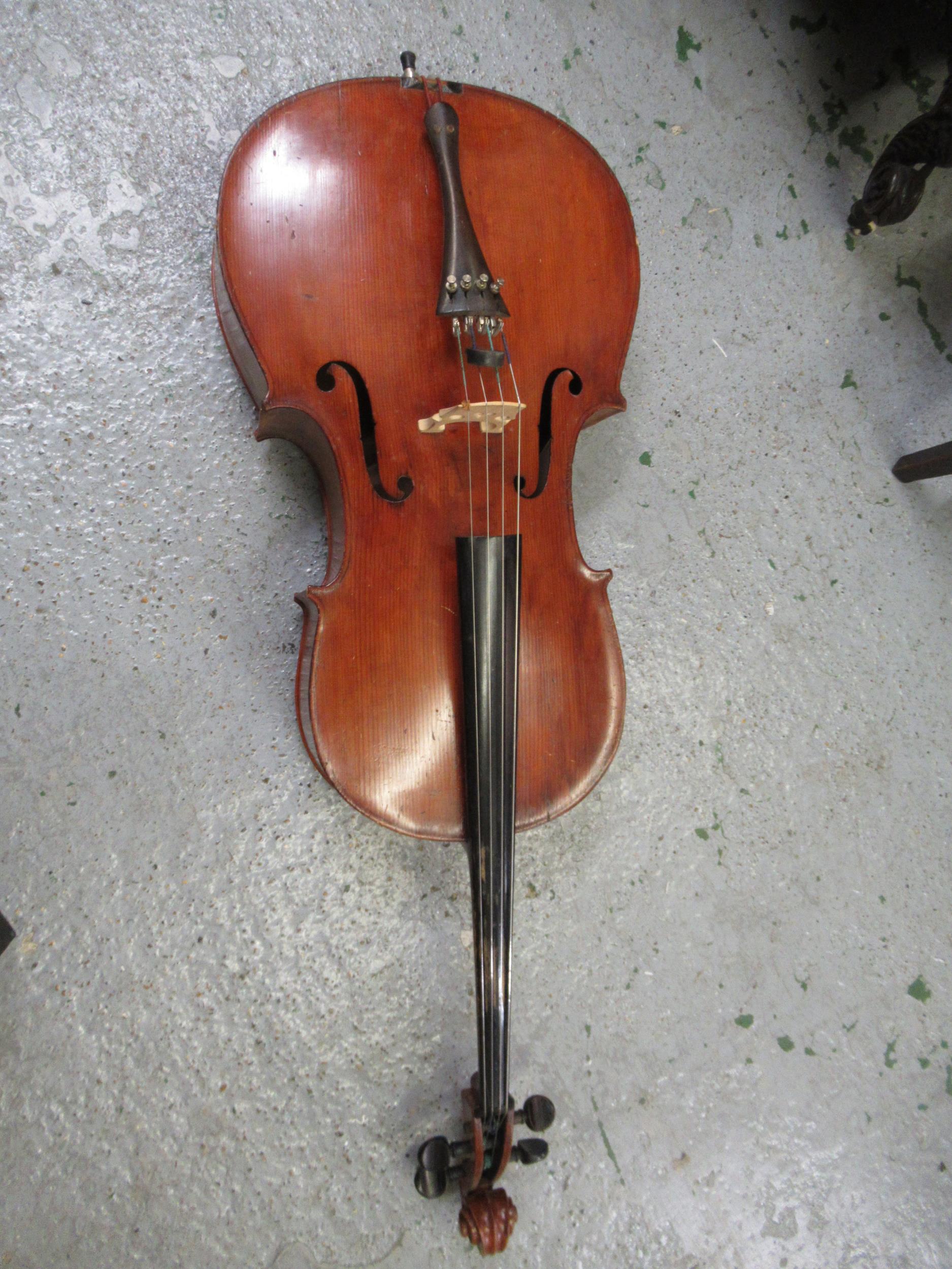 Late 19th / early 20th Century cello with 29.5in two section back, with bow, in a soft case