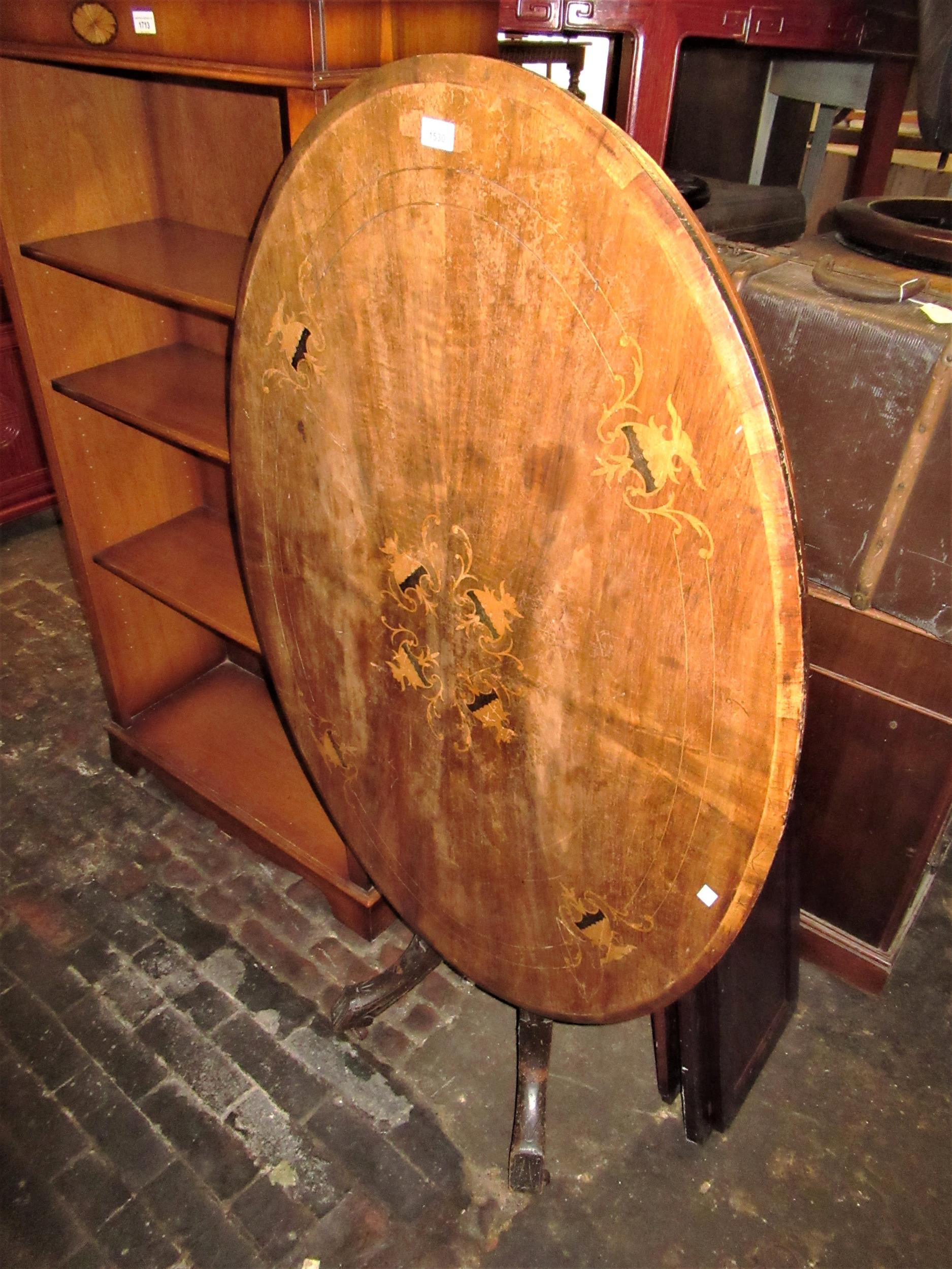 Victorian walnut and inlaid oval pedestal centre table on a cluster column support and quadruped