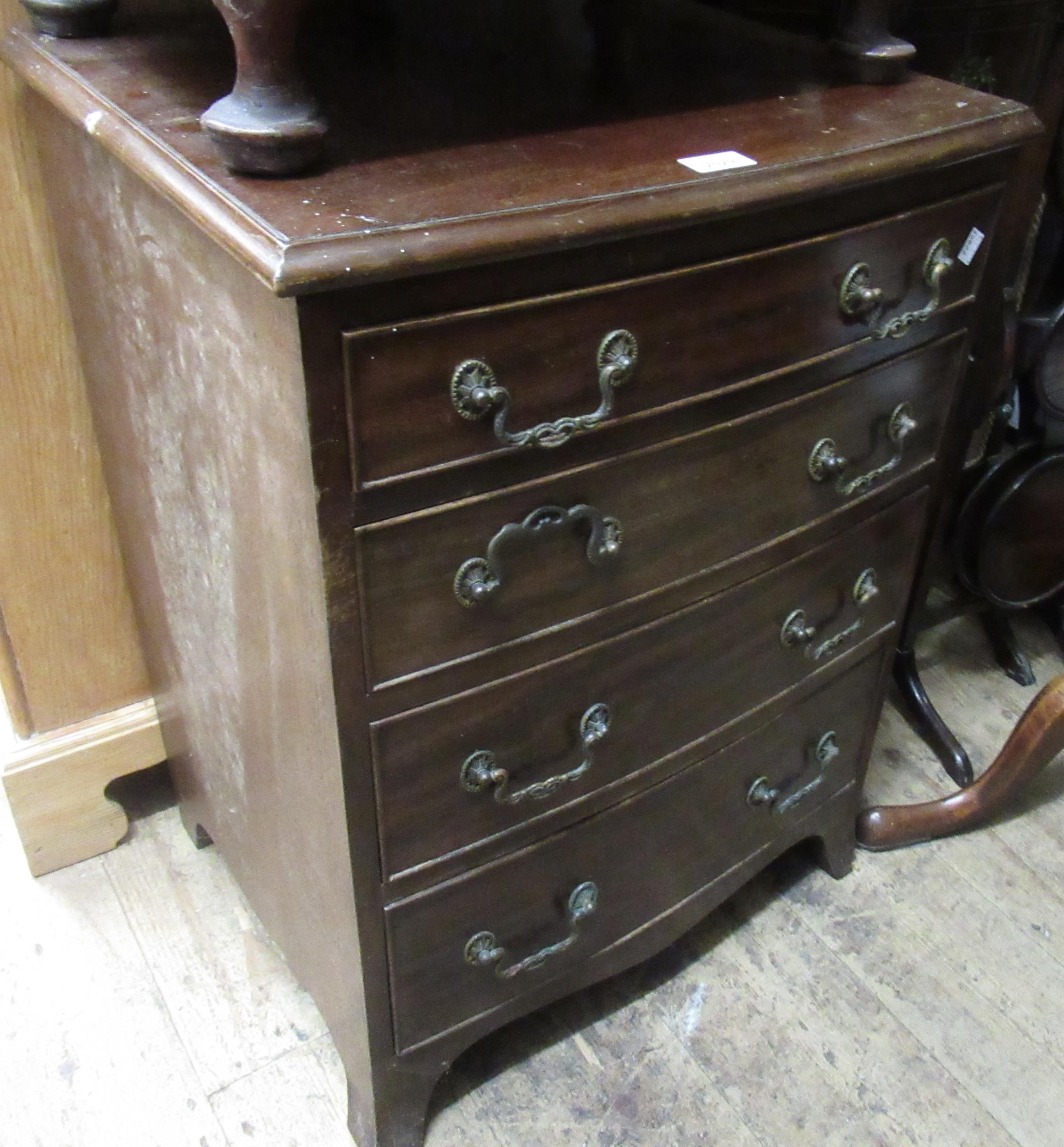 Reproduction mahogany small bow fronted chest of four drawers on splay supports, 21ins x 16.5ins x