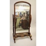 Victorian mahogany cheval mirror raised on scroll supports, 66ins high x 32ins wide