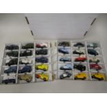 Box containing two trays of mainly Corgi diecast model vehicles of advertising Morris Minor vans