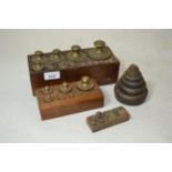 Complete set of brass scale weights in an oak holder, marked DB, set of scales, larger set of