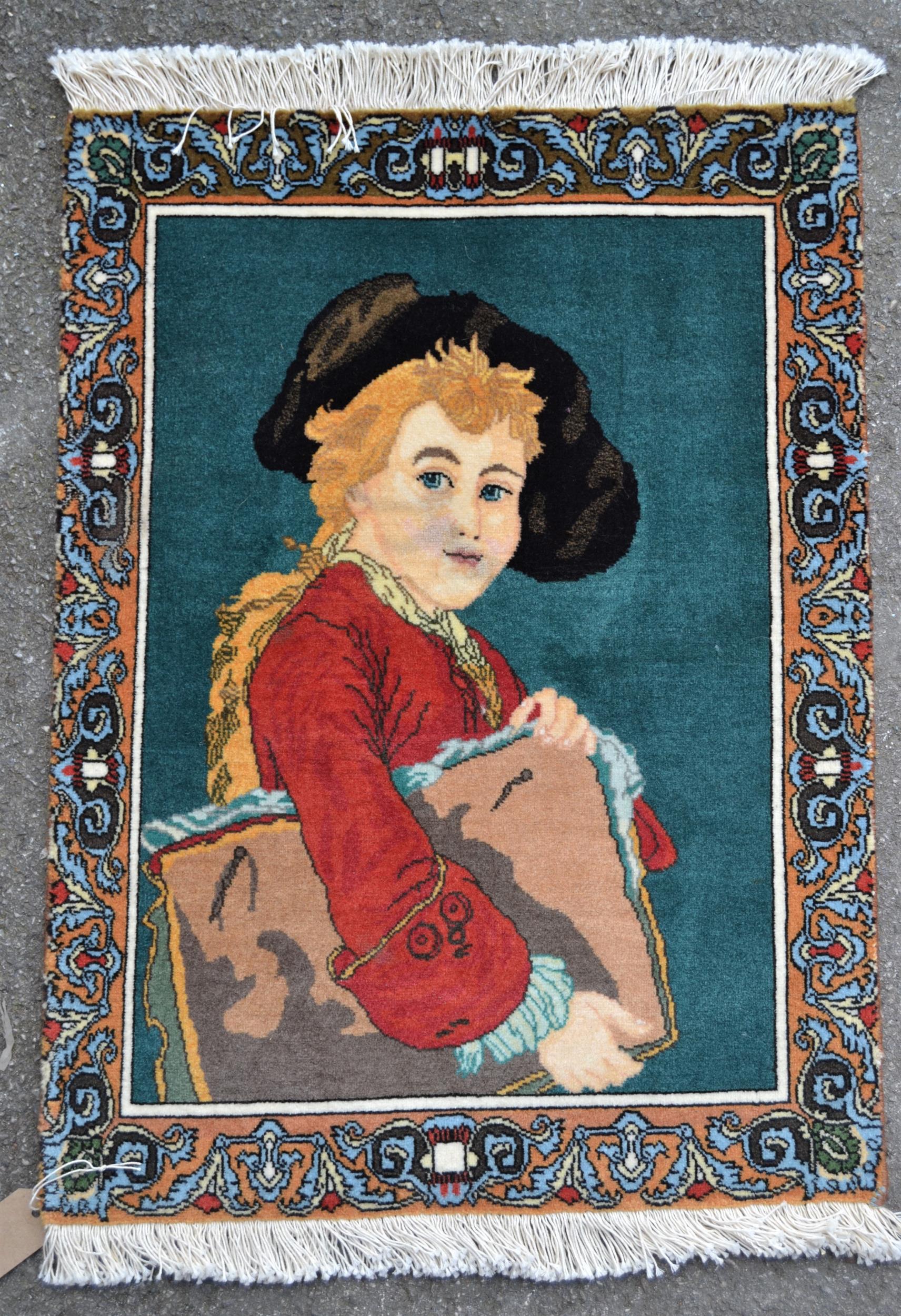 Small Indo Persian pictorial rug depicting portrait of a child, 26ins x 19ins