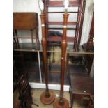 Pair of early 20th Century walnut lamp standards of plain baluster turned design with circular bases