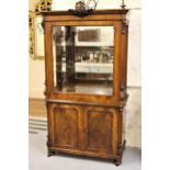 19th Century walnut display cabinet, the moulded cornice with floral surmount above a glazed panel