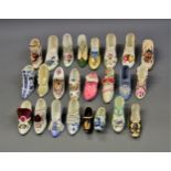 Box containing a collection of various porcelain miniature shoes, with floral decoration etc.