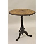 Victorian walnut and marquetry inlaid pedestal table, the shaped top above a carved and turned