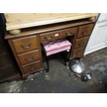 Mid 20th Century walnut twin pedestal desk with a leather inset top above seven drawers, brass