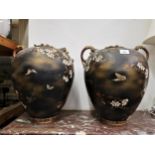 Pair of large Japanese earthenware two handled oviform vases decorated with birds and foliage on a