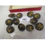 Set of eleven Japanese bronze buttons, each decorated in silver and gilt with various scenes,
