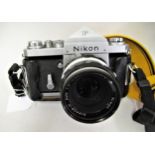 Nikon F SLR camera with F2 Nikon lens and a Nikon strap