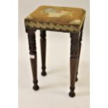 George III rectangular footstool with woolwork upholstered seat, raised on turned tapering supports,