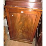 Victorian mahogany side cabinet with a single figured panel door enclosing shelves above a plinth,