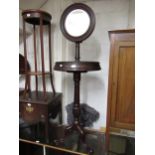 Victorian mahogany floorstanding toilet mirror, the circular mirror above double hinged circular