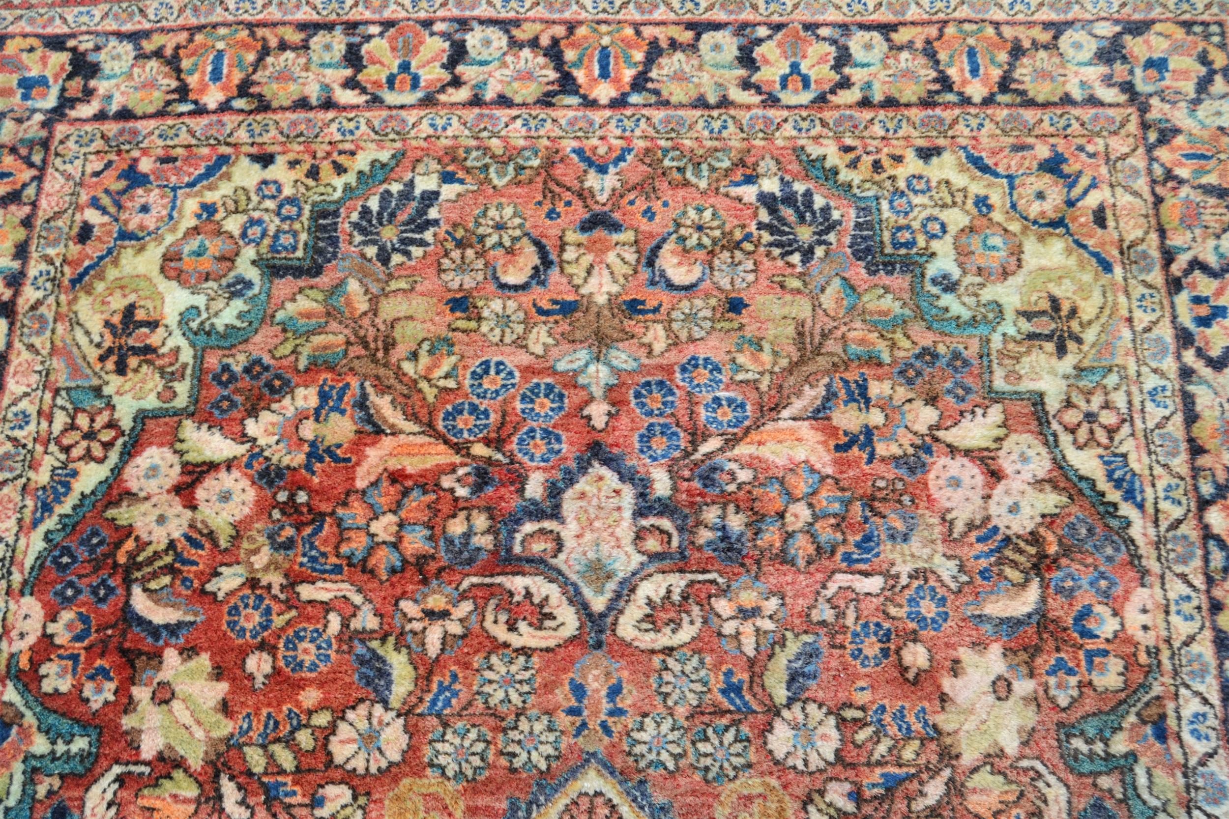 Tabriz rug with a lobed medallion and all-over floral design on a red ground with borders, 6ft - Image 2 of 4