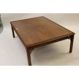 Large reproduction rectangular mahogany coffee table by William Tillman, the moulded top on four