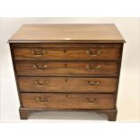 George III mahogany bachelor chest having moulded top with pull-out slide over four graduated long