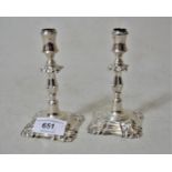 Pair of miniature late Victorian silver taper sticks with knopped stems and square shaped bases,