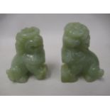 Pair of Chinese green stone carved figures of dogs of foe, 2.25ins high