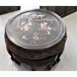 Circular nest of five oriental carved hardwood occasional tables on cabriole supports, the