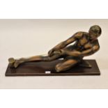Art Deco bronzed plaster figure of a male pulling on a rope, mounted on a wooden plinth