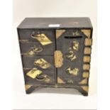 Japanese black lacquer table jewellery cabinet with gilded decoration, with four drawers, a single