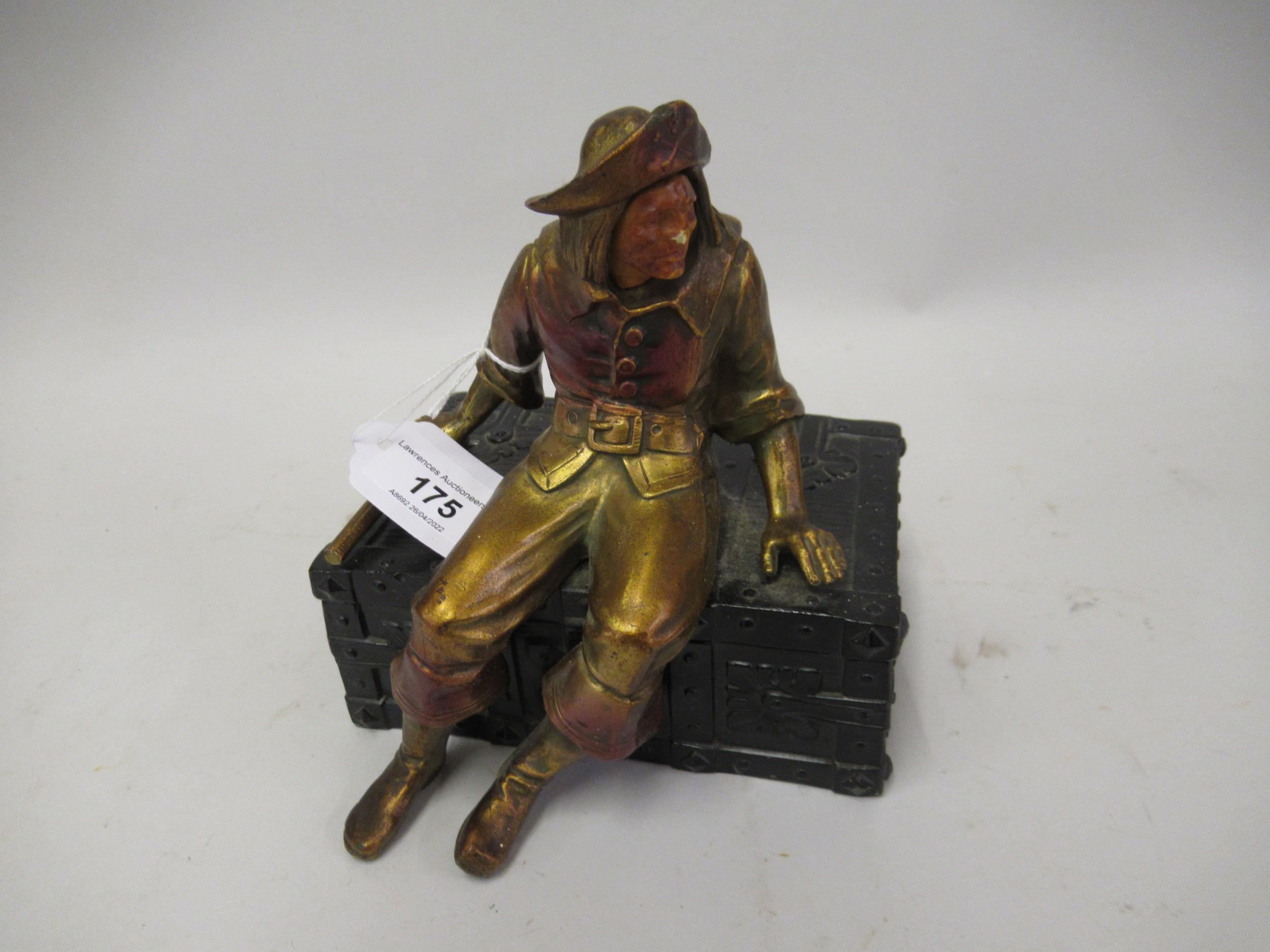 Small gilded and patinated metal trinket box in the form of a pirate seated on a treasure chest