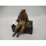 Small gilded and patinated metal trinket box in the form of a pirate seated on a treasure chest