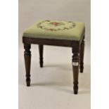 Small 19th Century mahogany stool with a needlepoint seat on turned tapering supports, together with