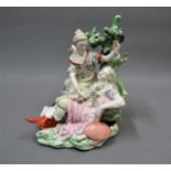 18th Century English porcelain figural group of a sleeping warrior and female laying flowers, 7.5ins