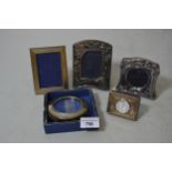Group of four various small modern silver mounted photograph frames and a silver mounted desk