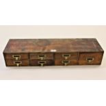 Small 19th Century mahogany bank of seven drawers with brass handles, 31ins x 5.5ins