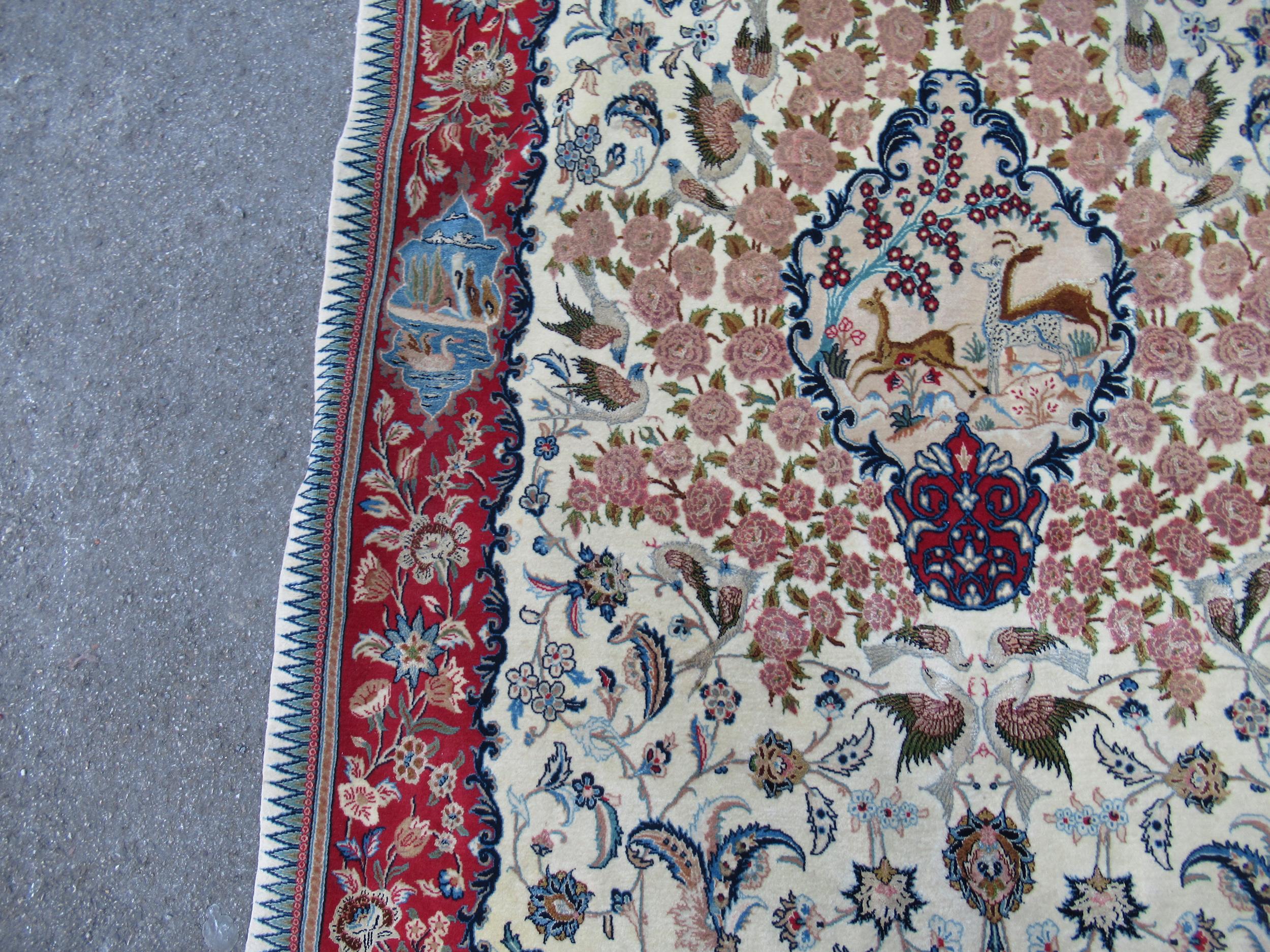 Isfahan part silk rug with a medallion, pictorial and all-over floral design on an ivory ground with - Image 8 of 13