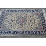 Small Indo Persian rug with a medallion and all-over floral design on an ivory ground with blue
