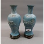 Pair of late 19th / early 20th Century Chinese pale blue stoneware baluster form vases with relief