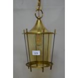 Solid brass and steel hanging lantern with tapering tinted glass shade on a long chain with