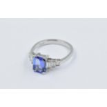 Platinum ring set rectangular tanzanite and baguette cut diamonds This is a modern ring in 'as new